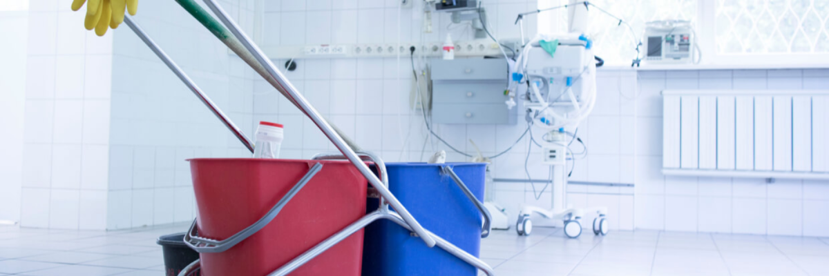 mop or cleaner buckets on a cart in a hospital room, medical cleaning, commercial cleaning or janitorial services for hospitals, healthcare and medical facilities